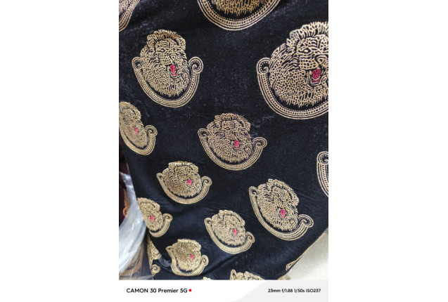 Black Isi-Agu with golden embroidery. price/yard