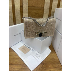 glittery champagne-colored clutch