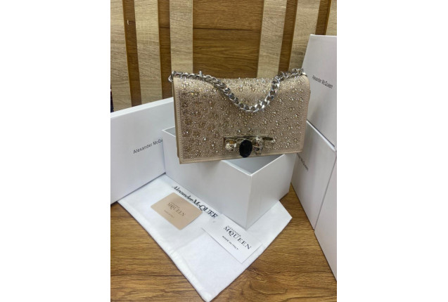 glittery champagne-colored clutch