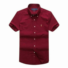 short-sleeved, button-up shirt in a deep red color